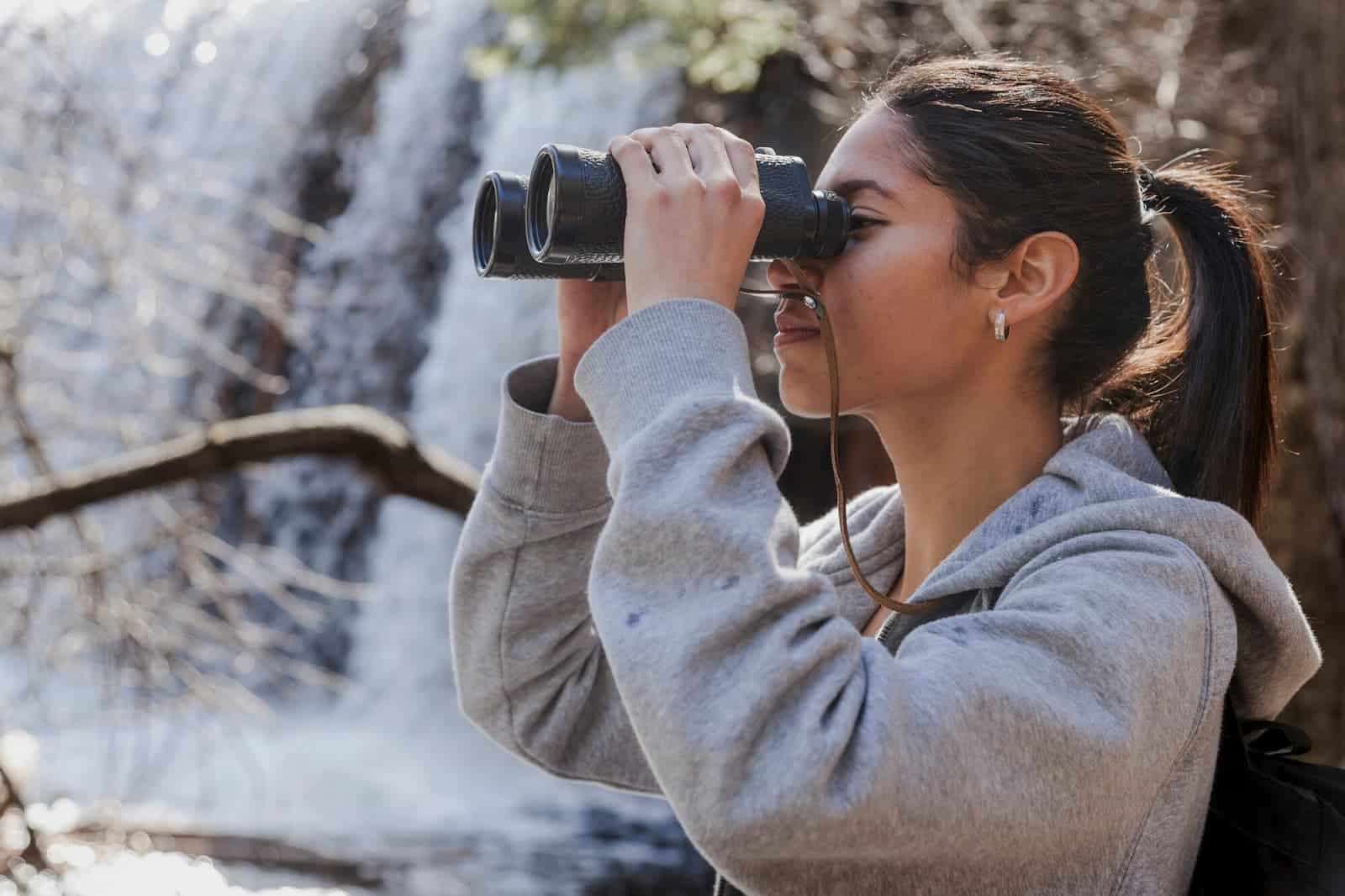 Girl looking through binoculars
